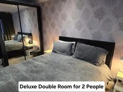 a bedroom with a bed with a double room for two people at Luxury on a Budget Chelmsford - B&B ROOM in a quiet family home in Chelmsford