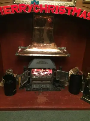 a large bell sitting on top of a stove at Nyton Hotel in Ely