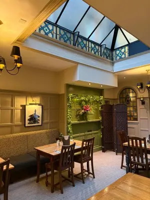 a dining room with a table and chairs at Lamb Hotel by Greene King Inns in Ely