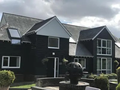 a black house with a black roof at The Old Red Lion Inn in Cambridge