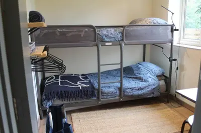 a bedroom with two bunk beds in a room at The Walled Garden in Long Melford