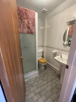 a bathroom with a toilet and a sink at The Prince of Wales in Huntingdon