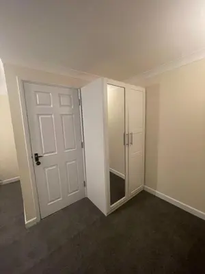 an empty room with a closet and a door at Relaxing double rooms in a beautiful house in Ipswich