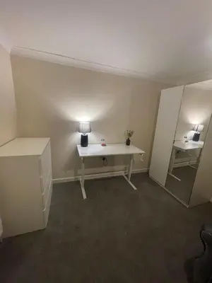 an empty room with a white desk and a lamp at Relaxing double rooms in a beautiful house in Ipswich
