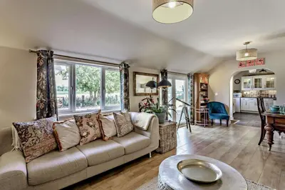 a living room with a couch and a table at 3 Bed in Sedge Fen oc-b28087 in Lakenheath