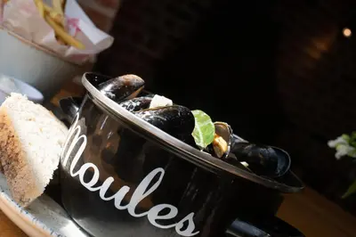 a bowl of food sitting on a table at The Red Lion in East Bergholt