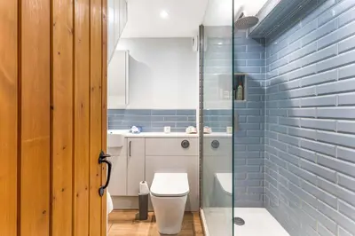 a bathroom with a toilet and a glass shower at Cottage, Central Saffron Walden, Garden, Little Braybrooke in Saffron Walden