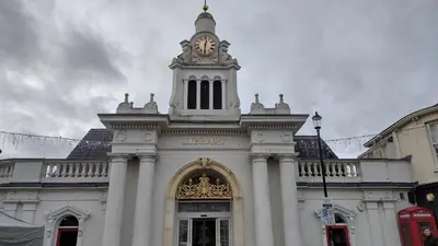 a building with a clock tower on top of it at Cottage, Central Saffron Walden, Garden, Little Braybrooke in Saffron Walden
