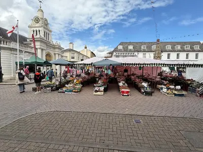 a market in a city with people walking around at Cottage, Central Saffron Walden, Garden, Little Braybrooke in Saffron Walden