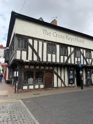 a black and white building with the cross keys hotel at Cottage, Central Saffron Walden, Garden, Little Braybrooke in Saffron Walden