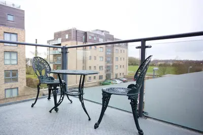 two chairs and a table on a balcony at Citystay Living - The Vie in Cambridge