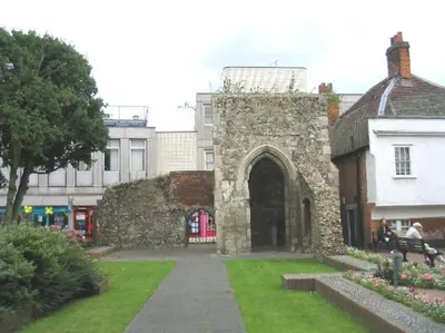 an old stone building with an arch in a park at Central Brentwood House in Brentwood