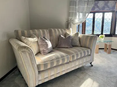 a couch in a living room with pillows on it at Duchess Apt 2 Modern 3Bedroom Apartment in Colchester Ideal for Long Stays, Relocations, Contractors, Secure Parking, WIFI in Colchester