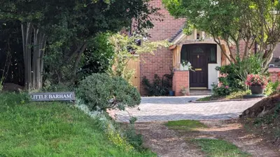 a house with a sign in front of a driveway at Little Barham B&B in Wethersfield