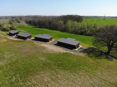 an overhead view of a group of buildings in a field at Meadow Valley Lodge 2 in Hintlesham