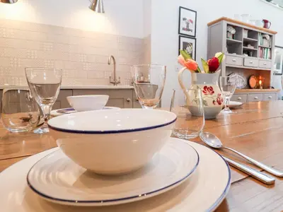 a table with a bowl on top of a table at Fawcett Cottage in Aldeburgh