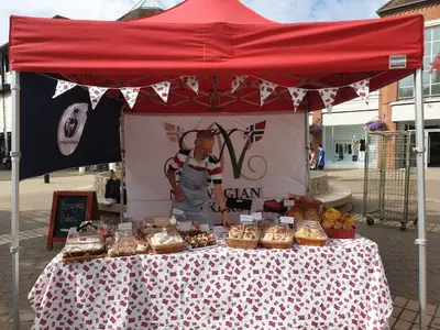 a table with a red tent with food on it at Chic Cottage Fireplace Patio Pet Train Stn in Wivenhoe