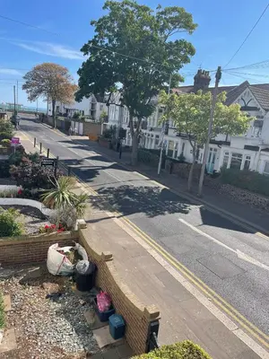 a view of a street with houses and a sidewalk at Herbies Stay in Southend-on-Sea