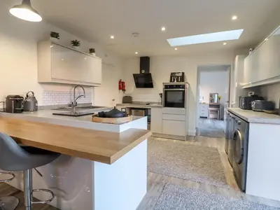 a kitchen with a sink and a counter top at Little Haven in Frinton-on-Sea