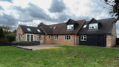 a large brick house with a large yard at Superb 4BD Stay in Wyton and Houghton Village in Wyton
