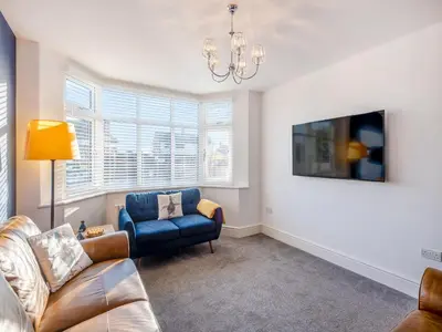 a living room with a couch and a chair at Coastal Gem in Clacton-on-Sea