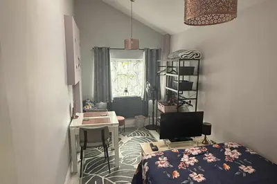 a small room with a desk and a bed at 1 Bed Sleeps 2 with Private Garden in Harlow