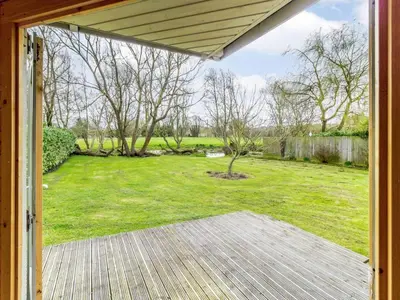 an open door to a backyard with a yard at 3 Bed in Ipswich oc-80545 in Stowmarket