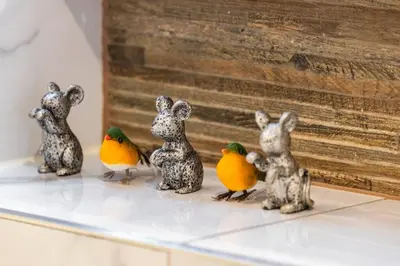 four miniature figurines of rabbits and birds on a shelf at Chelmsford Centre View Sleep 4 Next Chelmer canal in Chelmsford