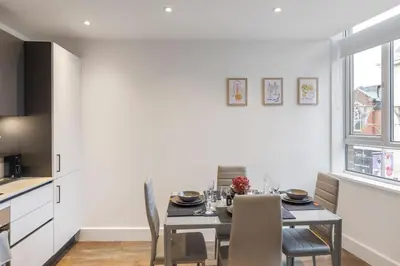 a kitchen and dining room with a table and chairs at Chelmsford Centre View Sleep 4 Next Chelmer canal in Chelmsford