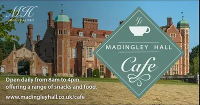 an image of a mansion with a sign in front at Cosy Country Hideaway opposite Three Horseshoes Pub in Madingley village in Madingley
