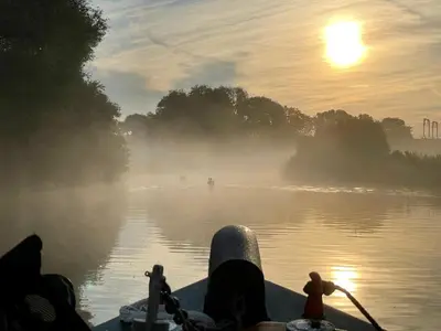 a person is on a boat in the water at Cambridge Narrowboats - Beautiful Narrowboat Glyndwr in Cambridge
