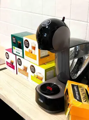 a blender sitting on a counter next to a box at Cozy studio near train station in Cambridge