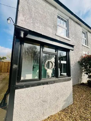 a window on the side of a house at Countryside Cottage By Walks & Coast, With Parking in Manningtree