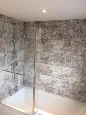 a bathroom with a shower and a bath tub at Beautiful en-suite bedroom in Ipswich