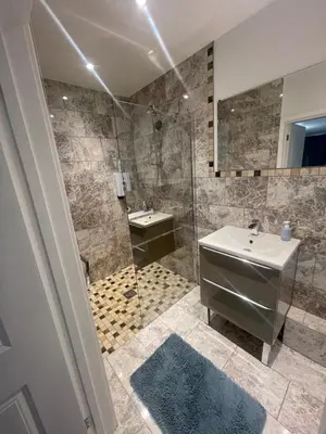 a bathroom with a sink and a shower at Beautiful en-suite bedroom in Ipswich