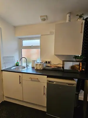 a kitchen with a sink and a counter top at Deluxe Town Centre Studio Stevenage in Stevenage