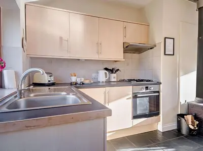 a kitchen with a sink and a stove at 2 Bed in Norwich oc-64075 in East Harling