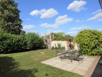a patio with a table and chairs in a yard at 2 Bed in Norwich oc-64075 in East Harling