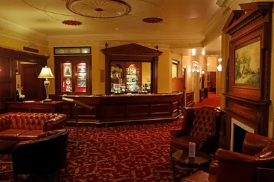 a lobby with a bar in a hotel at The Orwell Hotel in Felixstowe