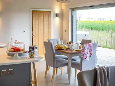 a dining room with a table and chairs and a window at 2 Bed in Diss oc-51468 in Wortham