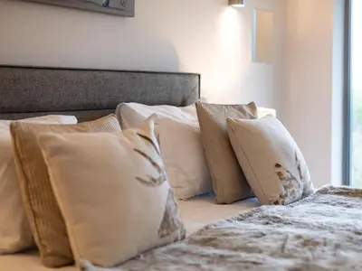 a bed with a bunch of pillows on it at 2 Bed in Diss oc-51468 in Wortham