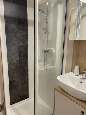 a bathroom with a shower and a sink at 3 BR - Luxury Family Home Near The Beach in East Mersea