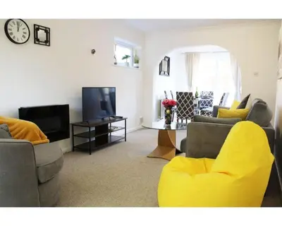 a living room with two couches and a tv at A Comfortable Nest for Contractors or Families - sleeps 8 in Chesterton