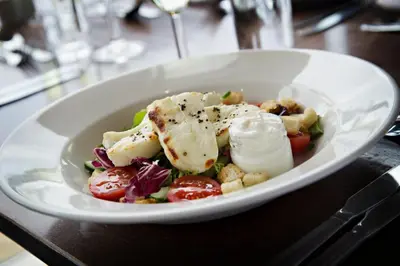 a white bowl of food on a table at Ufford Park Resort in Woodbridge