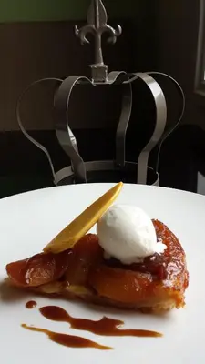 a plate of food with a piece of food with ice cream at The Crown Hotel in Woodbridge