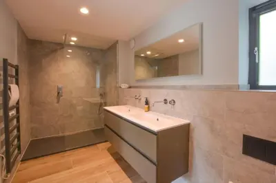 a bathroom with a sink and a shower at Court House, Aldeburgh in Aldeburgh