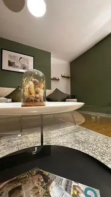 a living room with a table with a glass bowl with shells at Long Stay - Free Parking - Contractors - Train Station - Students in Colchester