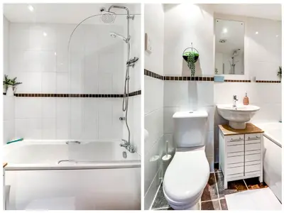 a bathroom with a tub and a toilet and a sink at Entire 2 Bed Flat Contractors Families and Relocators in Ware