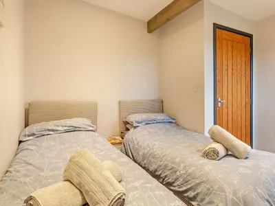 two beds sitting next to each other in a room at 2 Bed in Norwich oc-73624 in East Harling
