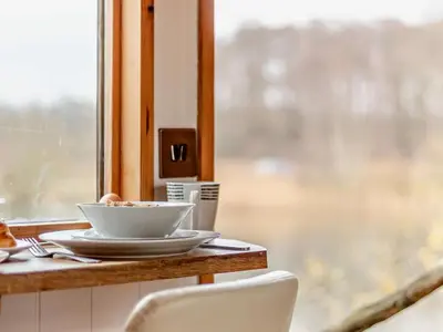 a bowl of food on a table next to a window at 1 Bed in Norwich oc-57900 in East Harling